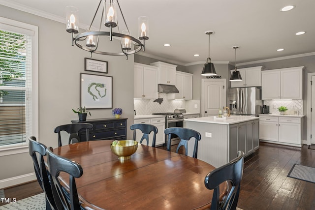 508 Morning Oaks Dr, Holly Springs, NC 27540 - dining room featuring a chandelier, recessed lighting, dark wood finished floors, and ornamental molding