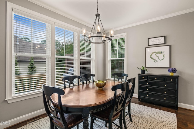 508 Morning Oaks Dr, Holly Springs, NC 27540 - dining area with a chandelier, plenty of natural light, ornamental molding, and dark wood finished floors
