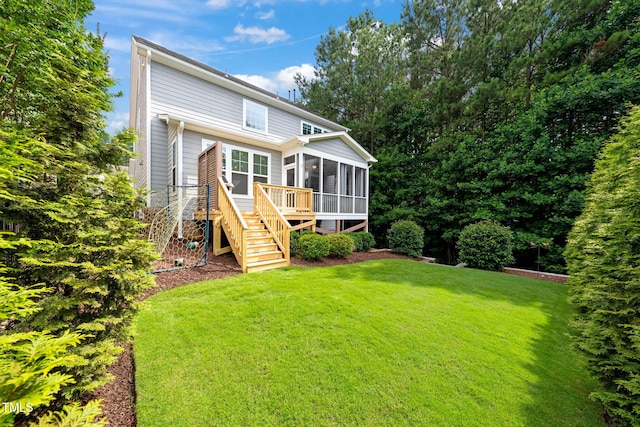 508 Morning Oaks Dr, Holly Springs, NC 27540 - back of property with a sunroom, stairs, and a yard