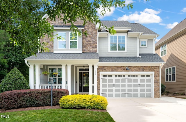 508 Morning Oaks Dr, Holly Springs, NC 27540 - view of front facade featuring stone siding, concrete driveway, covered porch, roof with shingles, and an attached garage