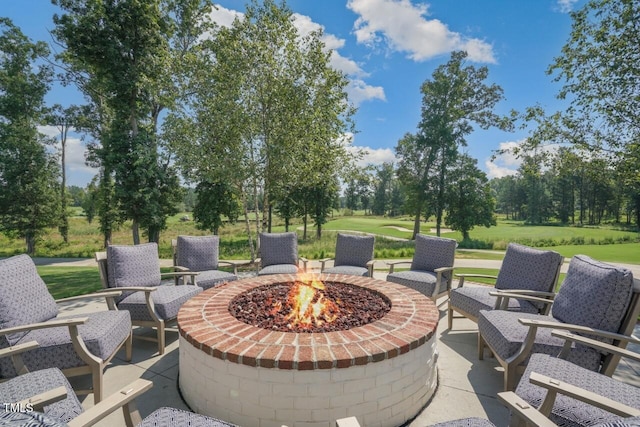 508 Morning Oaks Dr, Holly Springs, NC 27540 - view of patio / terrace featuring a fire pit and view of wooded area