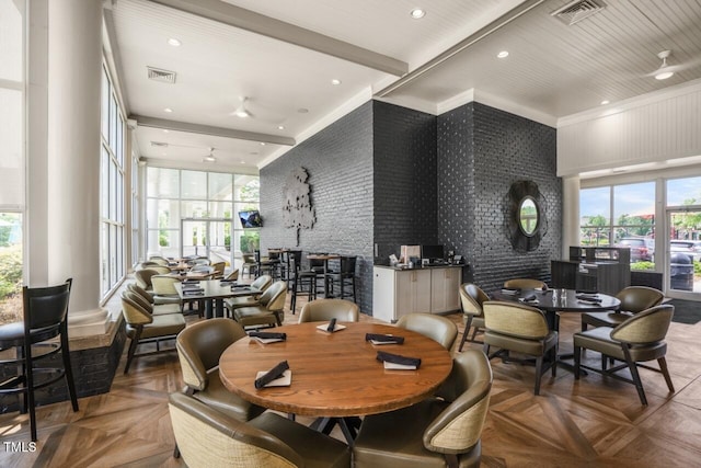 508 Morning Oaks Dr, Holly Springs, NC 27540 - dining area with healthy amount of natural light, a high ceiling, ornamental molding, and recessed lighting