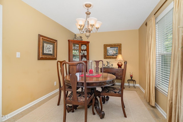 106 Scuppernong Ct, West End, NC 27376 - dining room with a chandelier and baseboards