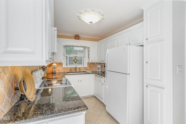 106 Scuppernong Ct, West End, NC 27376 - kitchen featuring white appliances, white cabinets, tasteful backsplash, light tile patterned flooring, and ornamental molding
