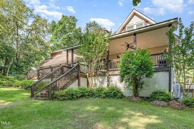 106 Scuppernong Ct, West End, NC 27376 - rear view of property featuring stairway, a ceiling fan, a yard, and a deck