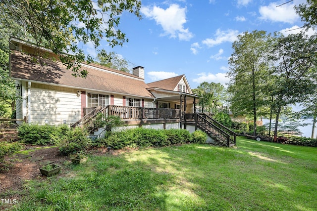 106 Scuppernong Ct, West End, NC 27376 - rear view of house with stairs, a lawn, and a chimney