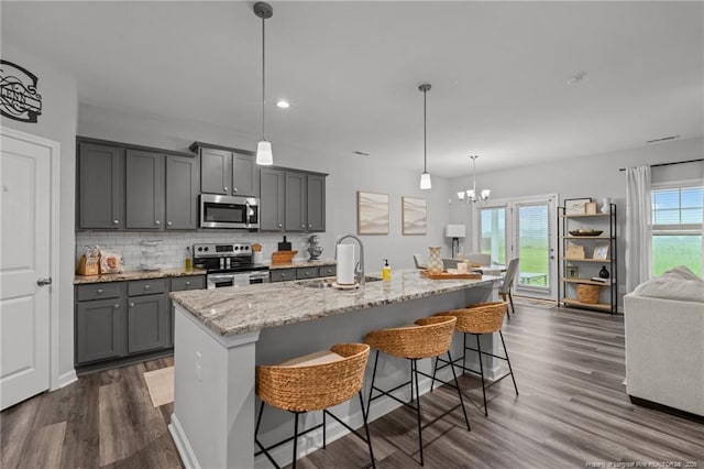 115 Doubletree Ln, Autryville, NC 28318 - kitchen with stainless steel appliances, gray cabinetry, plenty of natural light, dark wood-style floors, and recessed lighting