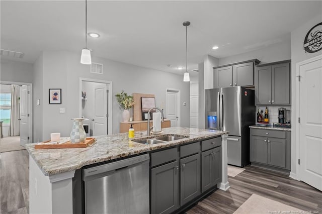 115 Doubletree Ln, Autryville, NC 28318 - kitchen with appliances with stainless steel finishes, gray cabinetry, dark wood-style flooring, backsplash, and recessed lighting