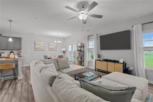 115 Doubletree Ln, Autryville, NC 28318 - living room featuring a ceiling fan, a chandelier, and wood finished floors