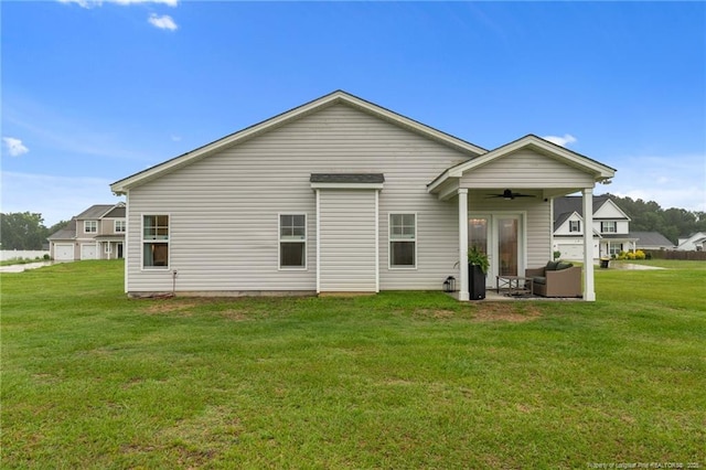 115 Doubletree Ln, Autryville, NC 28318 - back of property with ceiling fan, a lawn, and french doors