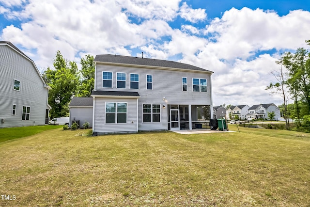 1051 Jura Ridge Dr, Fuquay Varina, NC 27526 - back of house featuring a yard, a patio, and a sunroom