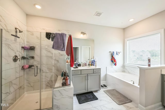 1051 Jura Ridge Dr, Fuquay Varina, NC 27526 - bathroom with marble finish floors, vanity, a bath, and a stall shower