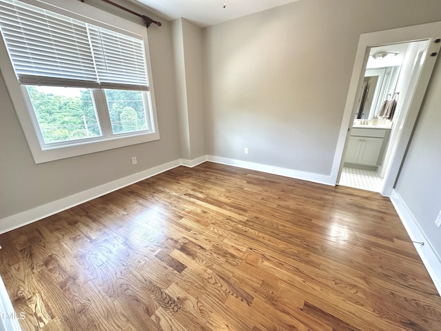 118 Chestnut St, Durham, NC 27707 - spare room featuring wood finished floors and baseboards