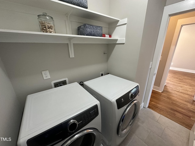 118 Chestnut St, Durham, NC 27707 - washroom featuring separate washer and dryer and tile patterned floors