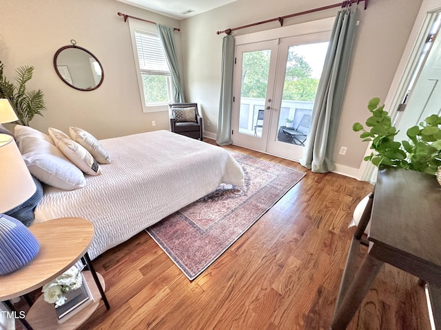 118 Chestnut St, Durham, NC 27707 - bedroom with access to exterior, wood finished floors, and french doors