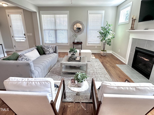 118 Chestnut St, Durham, NC 27707 - living room with a tile fireplace and wood finished floors