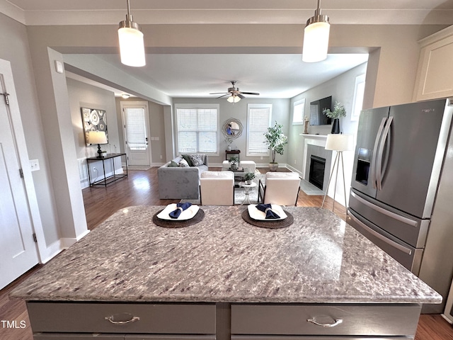 118 Chestnut St, Durham, NC 27707 - kitchen featuring stainless steel fridge with ice dispenser, ceiling fan, a kitchen island, gray cabinets, and wood finished floors