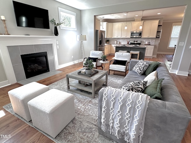118 Chestnut St, Durham, NC 27707 - living area with light wood-style flooring, a fireplace, and recessed lighting