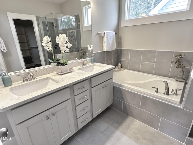 118 Chestnut St, Durham, NC 27707 - full bath with a shower stall, a garden tub, tile patterned flooring, and double vanity