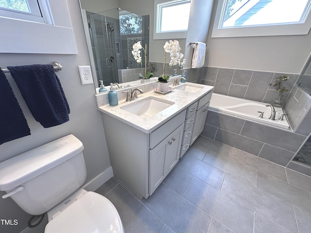 118 Chestnut St, Durham, NC 27707 - bathroom featuring healthy amount of natural light, a bath, double vanity, and tile patterned floors