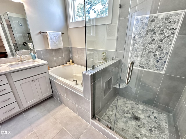 118 Chestnut St, Durham, NC 27707 - bathroom with vanity, a bath, a stall shower, and tile patterned flooring