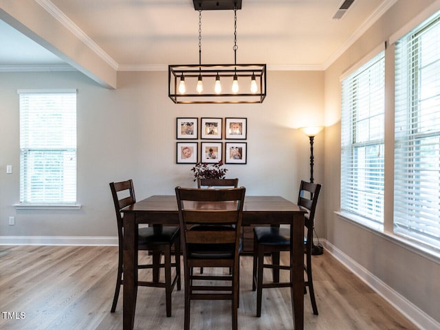 857 Stable Fern Dr, Fuquay Varina, NC 27526 - dining space featuring wood finished floors and ornamental molding