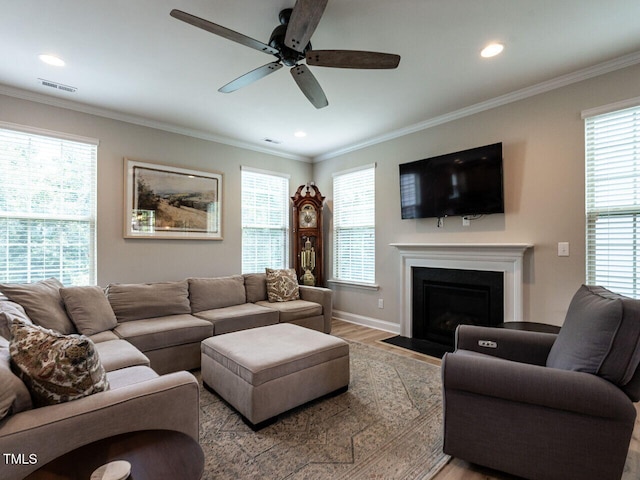 857 Stable Fern Dr, Fuquay Varina, NC 27526 - living room featuring wood finished floors, a ceiling fan, a fireplace with flush hearth, healthy amount of natural light, and recessed lighting