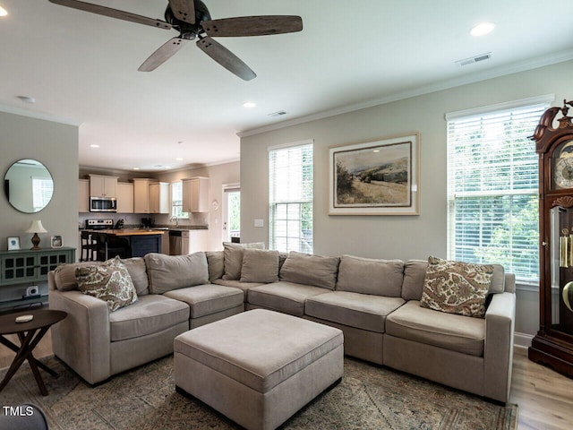 857 Stable Fern Dr, Fuquay Varina, NC 27526 - living area with crown molding, recessed lighting, ceiling fan, and wood finished floors