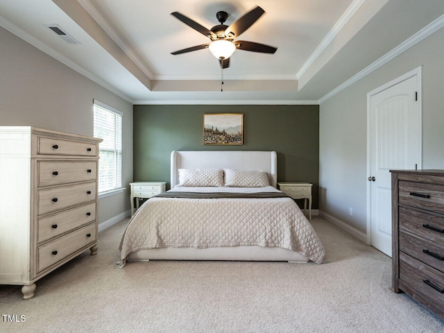 857 Stable Fern Dr, Fuquay Varina, NC 27526 - bedroom featuring a tray ceiling, light carpet, ornamental molding, and a ceiling fan