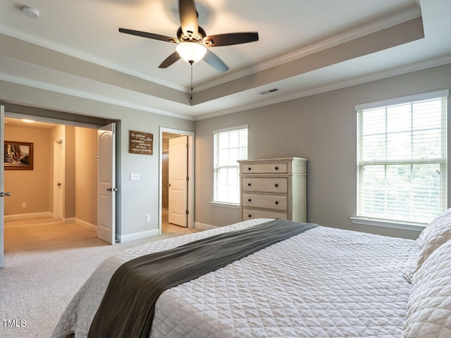 857 Stable Fern Dr, Fuquay Varina, NC 27526 - bedroom featuring a tray ceiling, light colored carpet, ornamental molding, and ceiling fan