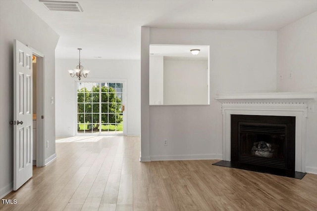 8326 Glenwood Springs Ct, Raleigh, NC 27616 - unfurnished living room featuring wood finished floors, a chandelier, and a fireplace