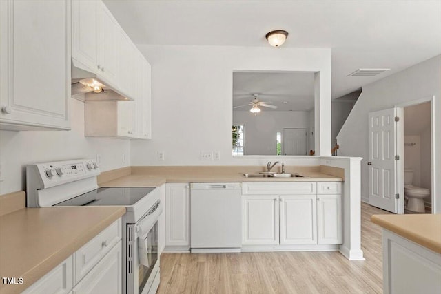 8326 Glenwood Springs Ct, Raleigh, NC 27616 - kitchen featuring white appliances, under cabinet range hood, a ceiling fan, and light wood finished floors