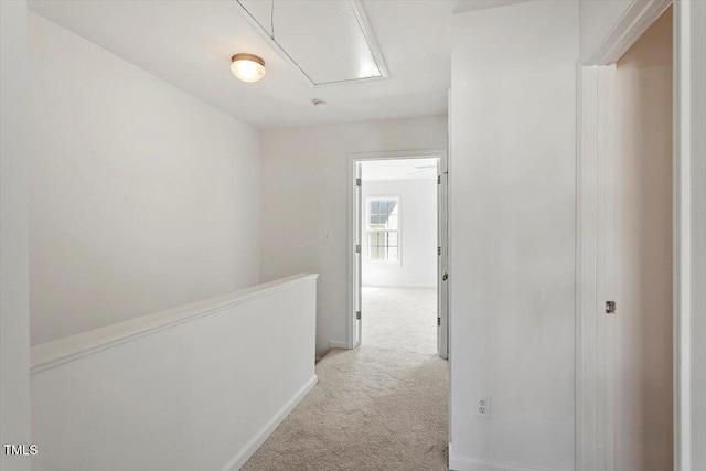 8326 Glenwood Springs Ct, Raleigh, NC 27616 - hall featuring attic access, light carpet, and an upstairs landing