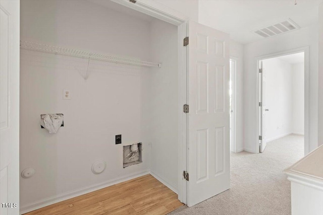 8326 Glenwood Springs Ct, Raleigh, NC 27616 - laundry room featuring electric dryer hookup, gas dryer hookup, and light carpet