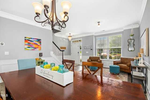 304 Forbes Rd, Wake Forest, NC 27587 - dining room with stairs, wainscoting, ornamental molding, a decorative wall, and a chandelier