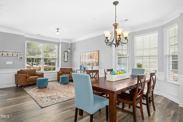 304 Forbes Rd, Wake Forest, NC 27587 - dining room with a chandelier, wood finished floors, crown molding, wainscoting, and a decorative wall