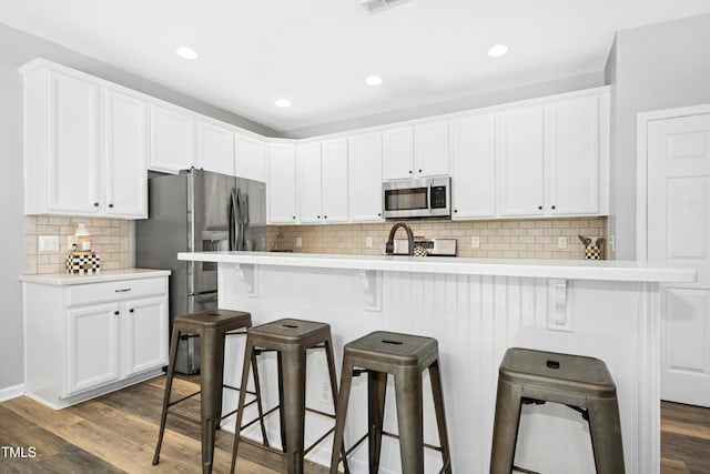 304 Forbes Rd, Wake Forest, NC 27587 - kitchen featuring appliances with stainless steel finishes, white cabinets, and recessed lighting