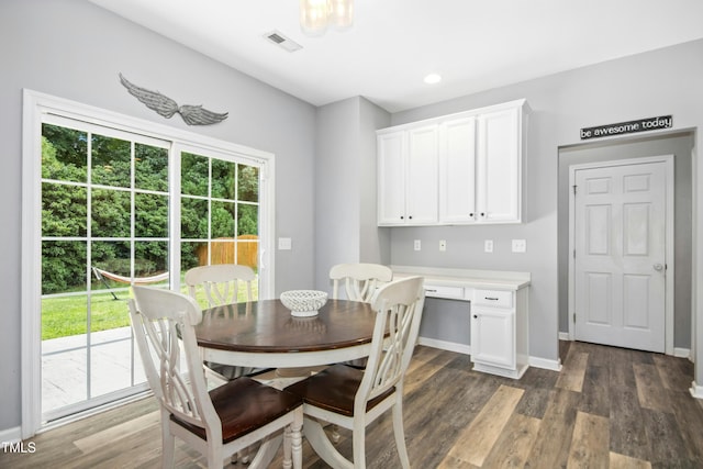 304 Forbes Rd, Wake Forest, NC 27587 - dining space with dark wood-style flooring and built in study area