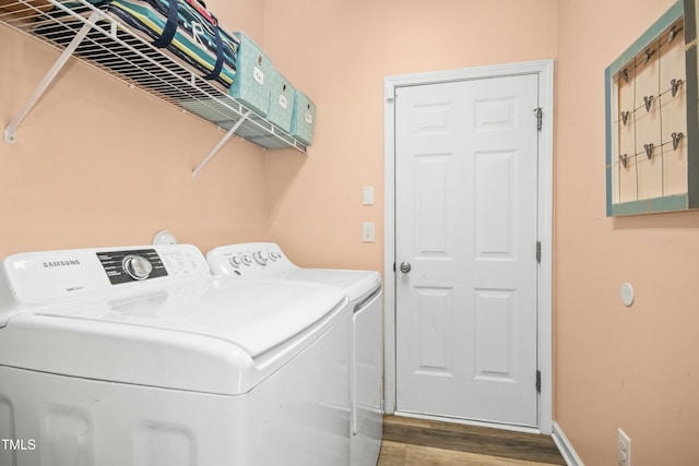 304 Forbes Rd, Wake Forest, NC 27587 - washroom featuring separate washer and dryer and wood finished floors