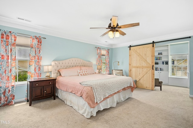 304 Forbes Rd, Wake Forest, NC 27587 - bedroom with ornamental molding, carpet flooring, a barn door, and ceiling fan