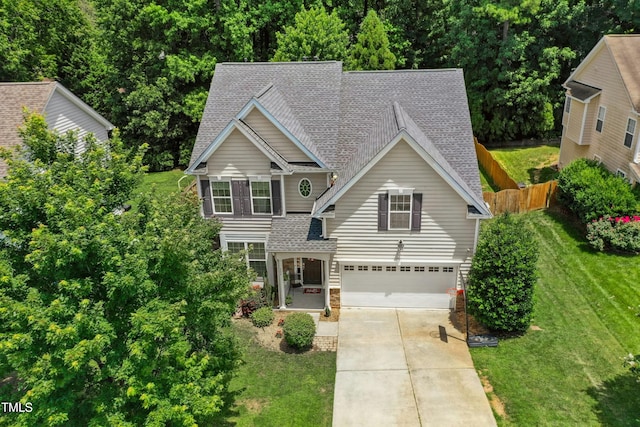 304 Forbes Rd, Wake Forest, NC 27587 - traditional-style home with roof with shingles, driveway, an attached garage, and stone siding