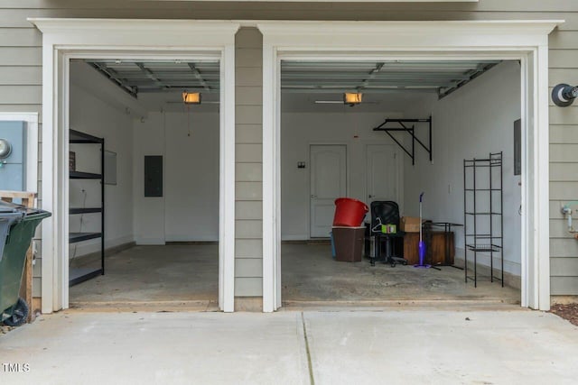996 Tender Dr, Apex, NC 27502 - garage with electric panel, concrete driveway, and a garage door opener