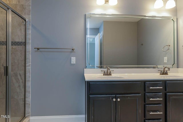 996 Tender Dr, Apex, NC 27502 - bathroom featuring a stall shower and double vanity