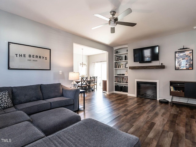 157 E Wilson St, Clayton, NC 27520 - living area with a ceiling fan, dark wood-style floors, and a glass covered fireplace