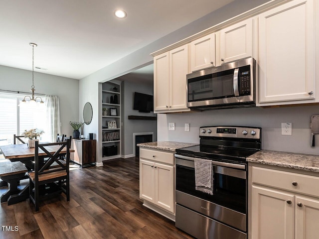 157 E Wilson St, Clayton, NC 27520 - kitchen featuring appliances with stainless steel finishes, a chandelier, recessed lighting, dark wood-style floors, and pendant lighting