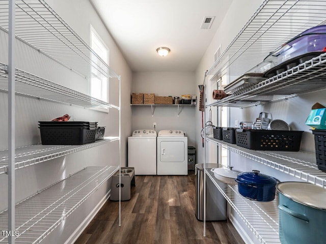 157 E Wilson St, Clayton, NC 27520 - laundry room with wood finished floors and washing machine and dryer
