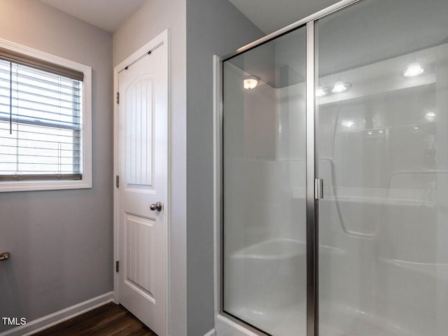 157 E Wilson St, Clayton, NC 27520 - bathroom featuring a shower stall and wood finished floors