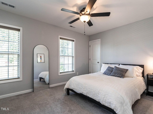 157 E Wilson St, Clayton, NC 27520 - carpeted bedroom with baseboards and a ceiling fan