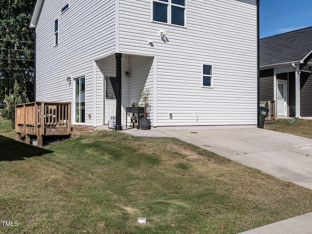 157 E Wilson St, Clayton, NC 27520 - back of house with a wooden deck and a lawn
