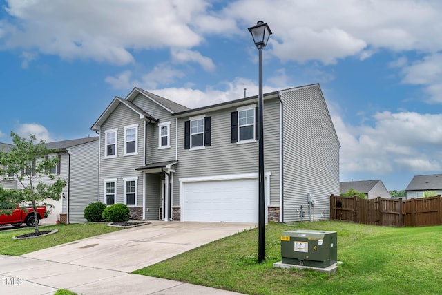 8005 Caithness St, Raleigh, NC 27616 - view of front of house featuring a garage, driveway, and stone siding